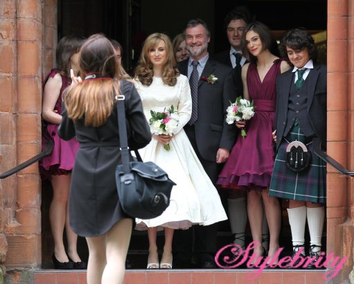 Bride Kerry Nixon poses for a photograph with bridesmaid Keira Knightley