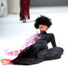 Model Does A Naomi Campbell as she dramatically falls during French Couture Singapore Fashion Show